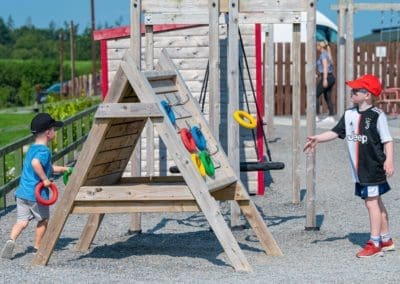 Kids playing ring toss in Mellowes Adventure Centre