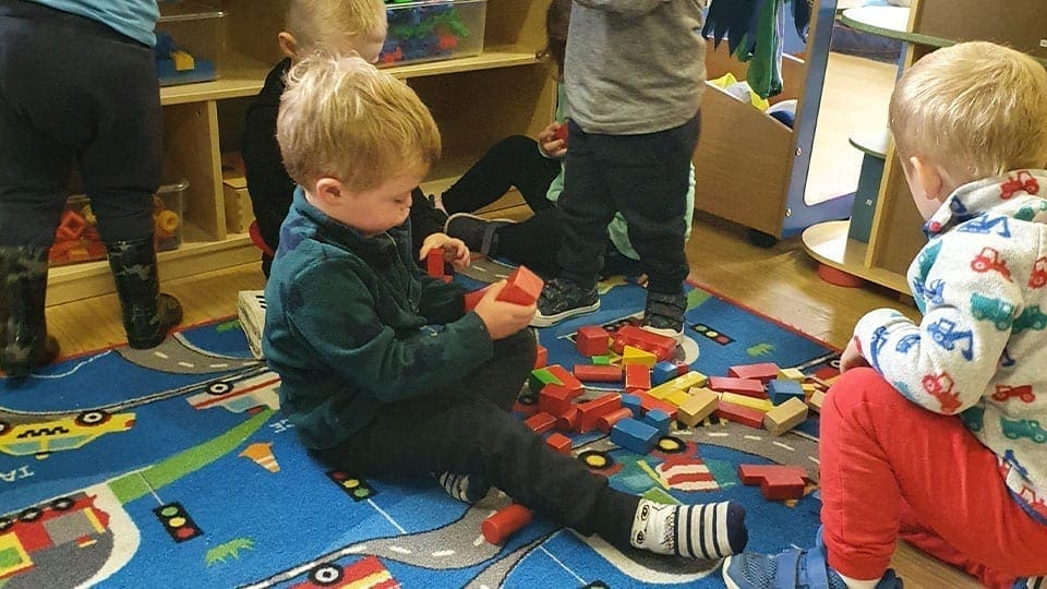 Child Playing with blocks Childcare at Mellowes
