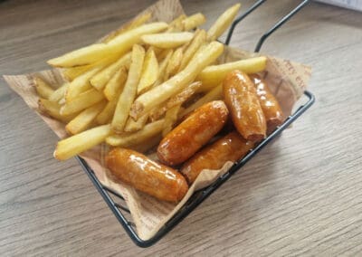 Sausages and chips served in a basket hot food for kids lunch at Mellowes Adventure Centre